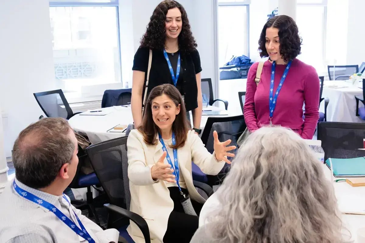 Professionals collaborating during a group workshop activity.