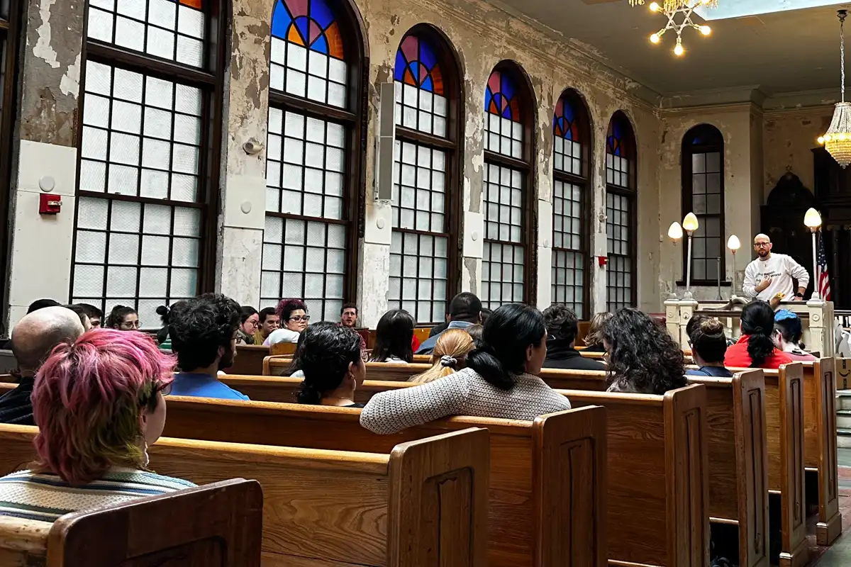 Congregants and leaders gathered inside a Boston synagogue during a community event
